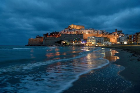 Old town with the Romanesque castle from the 14th century, blue hour, Peñíscola, province