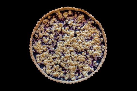 Blueberry cake with crumble on black background, Lower Saxony, Germany, Europe