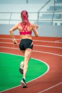 Athlete running at high speed on a track in the stadium, Glaspalast, Sindelfingen