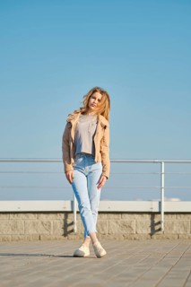 Young woman in casual clothes posing on the street