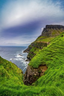 Huge cliffs in Gasadalur, Vagar, Faroe islands, Denmark, Europe