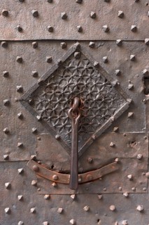 Old door knocker on the front door of the former Palazzo Pinelli Parodi in the historic centre,