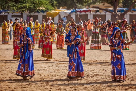 PUSHKAR, INDIA, NOVEMBER 21, 2012: Unidentified Rajasthani girls in traditional outfits dancing at