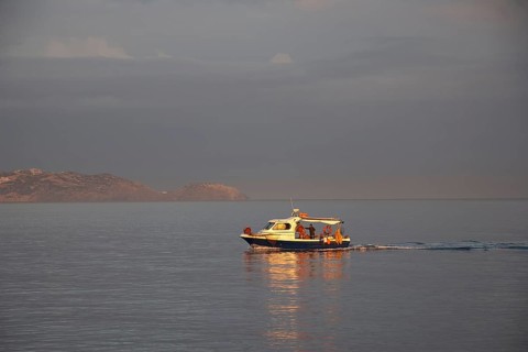 Morning light, cloudy sky, fishing boat, harbour, Heraklion, capital, island of Crete, Greece,