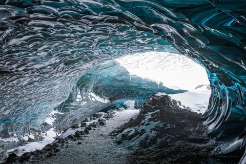 Aquamarine-coloured ice combs at the entrance to Pröng Ice Cave, Sudurland, Iceland, Europe