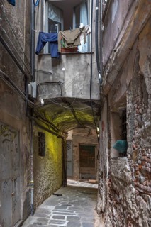 Hanging laundry in front of a window in an alley in the historic centre, Genoa, Italy, Europe