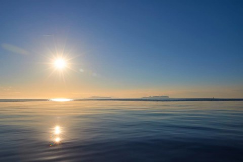 Sun as star, sunrise, morning light, view over the sea, Levanzo, Favignana, Marettimo, Egadi