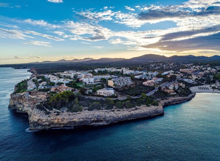 Sunset over Cala Anguila-Cala Mendia from a drone, Porto Cristo, Majorca, Spain, Europe