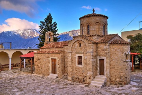 Byzantine church, dome, bell centre, tree, snow-capped mountains, cloudy blue sky, Myriokephala,