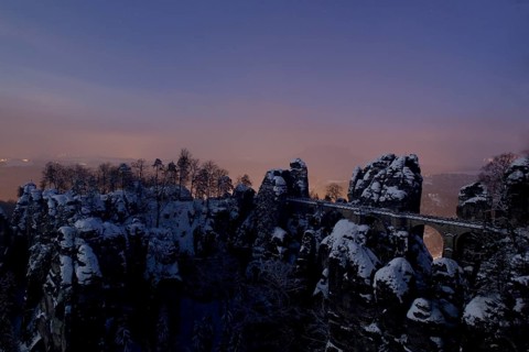 Bastei rock at full moon in winter