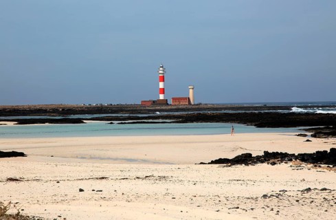 Red and white striped lighthouse, Faro de Toston, El Cotillo, Fuerteventura, Canary Islands, Spain,