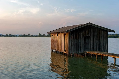 Boathouse with wooden jetty, sunset at Lake Kochel near Kochel am See, Bavarian Alpine foothills,