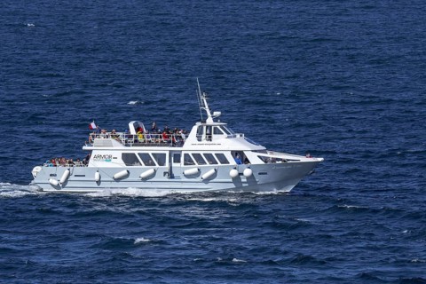 Excursion boat Armor Navigation sailing with tourist along Côte de granit rose, Pink Granite Coast