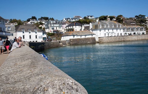 Village buildings and harbour wall, St Mawes, Cornwall, England, UK