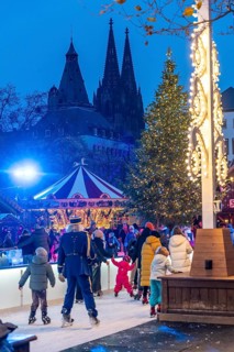 Ice rink at the Christmas market on the Heumarkt in the old town of Cologne, Cologne Cathedral,