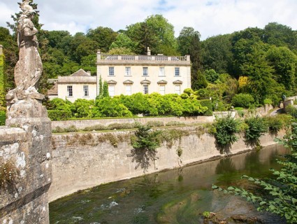 Statue of Britannia on the fifteenth century bridge over the River Frome, Iford Manor, near