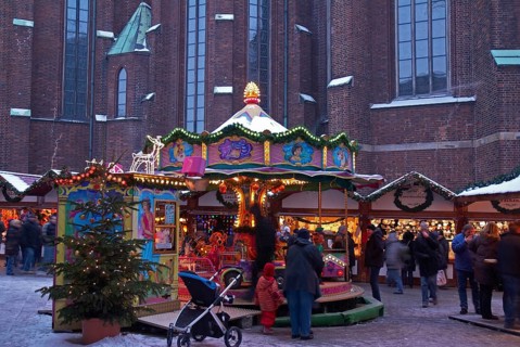 Europe, Germany, Hamburg, Christmas market in front of St Peter's Church, Children's carousel,