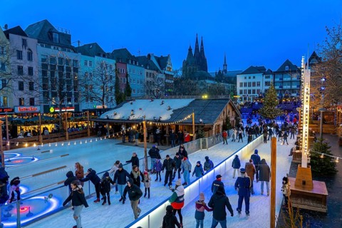 Ice rink at the Christmas market on the Heumarkt in the old town of Cologne, Cologne Cathedral,