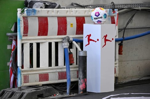 Adidas Derbystar match ball on platform, Bundesliga logo, MHPArena construction site, MHP Arena