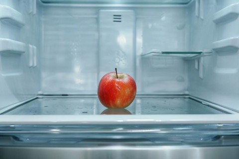 Red apple in open refrigerator. KI generiert, generiert, AI generated