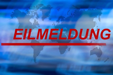 Symbolic image: The word breaking news on an abstract background