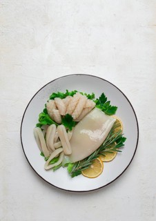 Fresh squid, raw, carcass, cut into rings, top view, no people