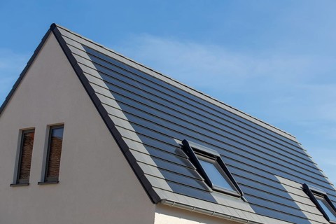 Solar roof: detached house with solar roof tiles as a high-quality and attractive alternative to