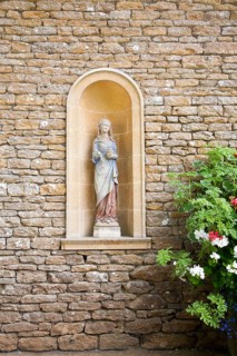 Statue detail in Italianate garden of landscape gardener Harold Ainsworth Peto created between 1899