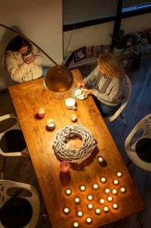 Symbolic image energy saving, cold winter, energy crisis, cold flat, mother and daughter dressed