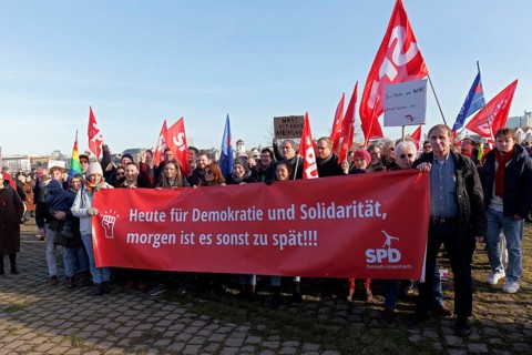 Protesters of the SPD with banner, today for democracy and solidarity, otherwise it will be too