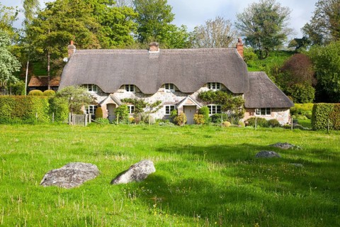 Two historic semi-detached thatched cottages at Lockeridge village, Wiltshire, England, United