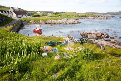 Small fishing boat at moorings on the east coast of Barra, Outer Hebrides, Scotland, UK