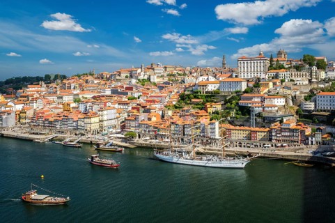 Aerial view of Porto city and Douro river with moored sailling ship from Dom Luis bridge I. Porto,