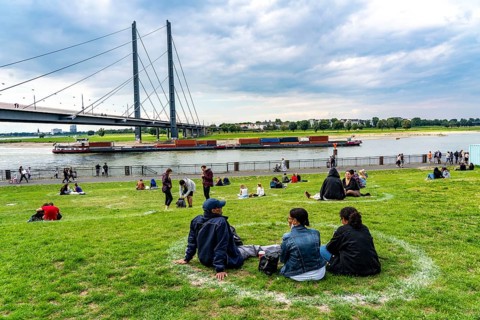 Düsseldorf on the Rhine during the corona crisis, corona circles, to comply with the distance