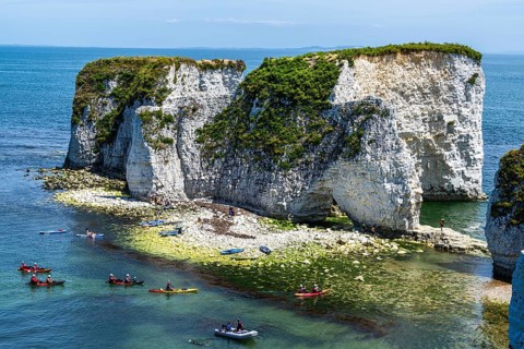 People on kayaks and paddleboards, White Cliffs. Old Harry Rocks Jurassic Coast, Dorset Coast,