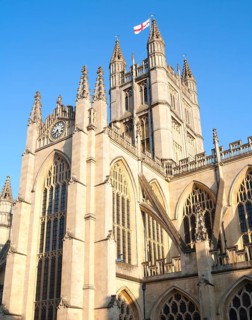 English flag flying on the tower of the Abbey church, Bath, Somerset, England, United Kingdom,