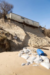 March 2018, Clifftop property collapsing due to coastal erosion after recent storm force winds,