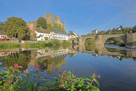 Old Lahn bridge built 1448 with castle built 12th century, Lahn valley, reflection, historic stone