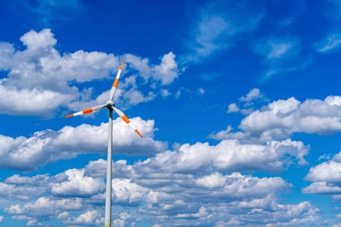 Wind turbine, wind energy plant from the manufacturer Enercon, blue sky with many white clouds,