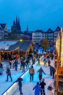 Ice rink at the Christmas market on the Heumarkt in the old town of Cologne, Cologne Cathedral,