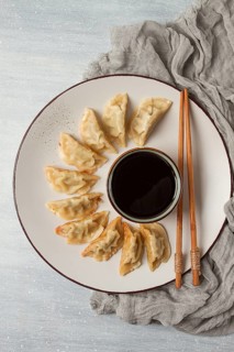 Japanese Gyoza dumplings, fried, with sauce, top view, without people, tinted, selective focus