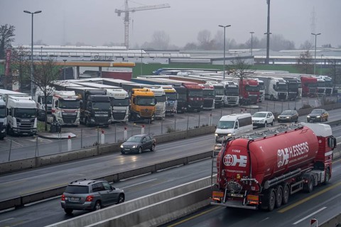 Heavy traffic on the A2 at the Bottrop-Süd service area, overcrowded lorry parking in the evening,