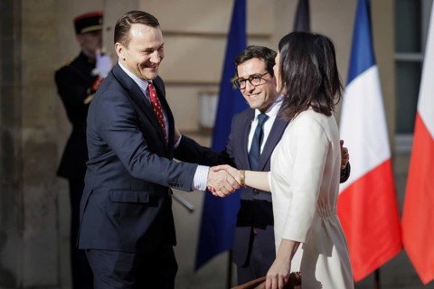 (R-L) Rados˜Çaw Sikorski, Minister for Foreign Affairs of the Republic of Poland, Stephane