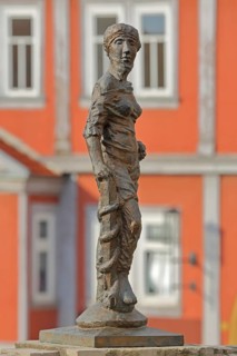 Sculpture Fortitudo by Bernd Göbel 2021 with blurred Old Town Hall, allegory, Greek mythology,
