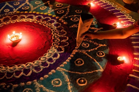 Students of Cotton University lighting making a rangoli on the occasion of Diwali Festival, on