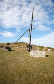 Antique crane forming monument to the quarrying heritage as the Home of Portland Stone, Isle of