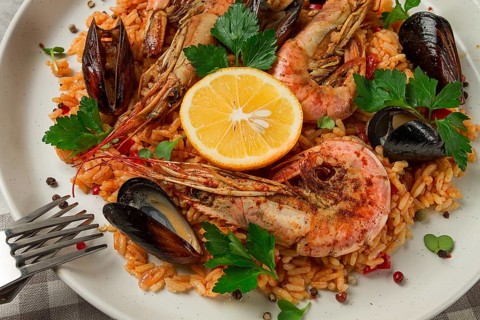 Seafood paella, shrimp and mussels risotto, rice, homemade, top view, no people