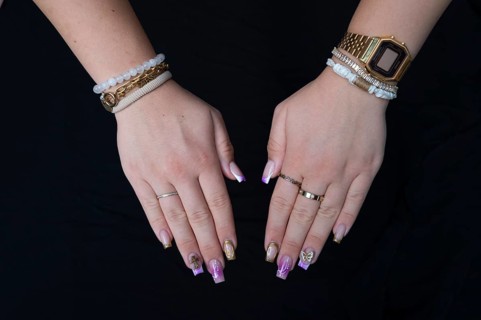 Colourful fingernails of a young woman, on a black background, Baden-Württemberg, Germany, Europe