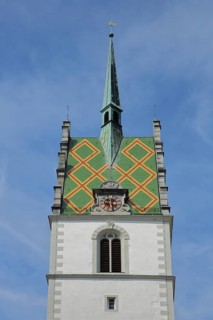 Tower of the Gothic St. Nicholas Church, spire, roof tile, pattern, clock, church tower,