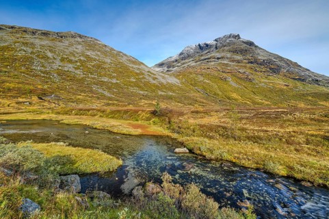Autumn in Reinheimen National Park, mountains with river in Valldalen valley, Møre og Romsdal,